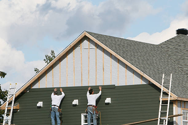 Professional Storm Damage Siding Repair technician working in Oaks, PA